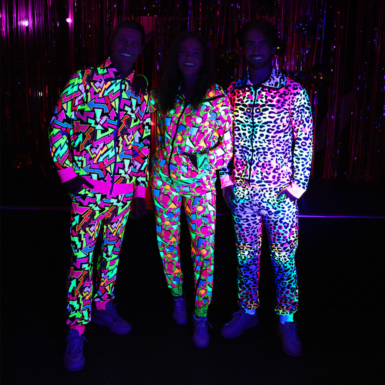 Op deze afbeelding zie je een Kostuums, van het merk Boland. Trainingspak 90s Pop Art Blacklight Vrouw Kostuum