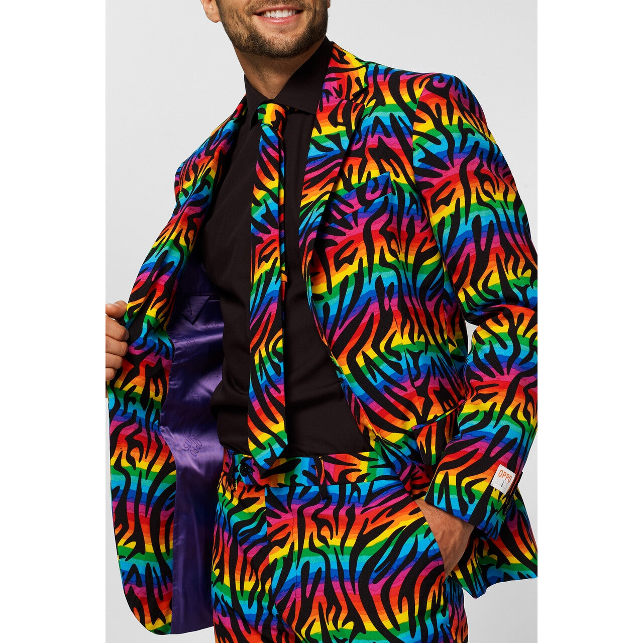 Op deze afbeelding zie je een Kostuums, van het merk Opposuits. Wild Rainbow Man Kostuum