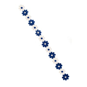Op deze afbeelding zie je een Decoratie, van het merk PartyXplosion. Bloemetjesband 3m Blauw-Wit